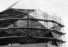 Repair and renovation in progress on the geodesic dome of the 15-foot Bubble Chamber Assembly Building