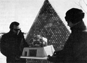 Main Ring's Bob Sheldon (left) shows model of translucent, honeycomb effect of proposed Bubble Chamber geodesic dome to Hank Hinterberger, NAL Technical Services. Dome will be made of discarded beverage cans