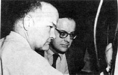 Donald E. Young, Accel. Section, and James R. Sanford, Assoc.Dir. for Program Plan., at the oscilloscope