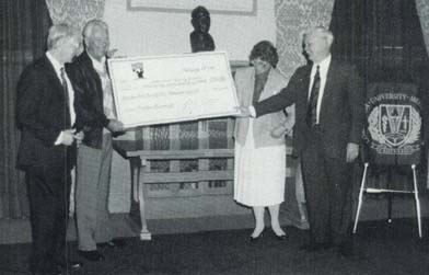 Ken Venturi, professional golfer and CBS sports commentator, presents a facsimile of a 
check in the amount of $275,000 to Loma Linda University Medical Center president David 
B. Hinshaw, Sr., MD. Receiving the check with Dr. Hinshaw are James M. Slater, MD (left), 
chair, department of radiation medicine; and B. Lyn Behrens, MB, BS, president, Loma 
Linda University width=